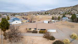 Birds eye view of property featuring a mountain view