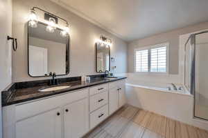 Grand Master Bath with Double Vanity overzied soaking Tub and shower.