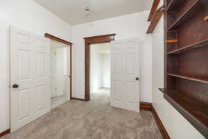 Hallway with light carpet