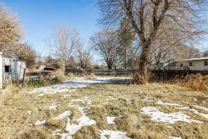 View of yard covered in snow