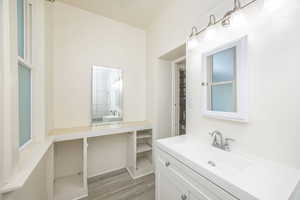 Bathroom featuring vanity and hardwood / wood-style flooring