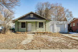 Bungalow-style house featuring a garage