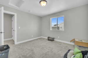 Empty room featuring light carpet