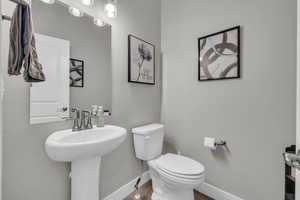 Bathroom featuring sink and toilet