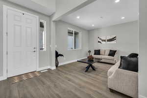 Living room with wood-type flooring