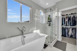 Bathroom featuring separate shower and tub