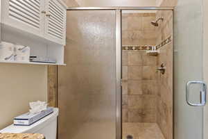 Bathroom featuring toilet and walk in shower