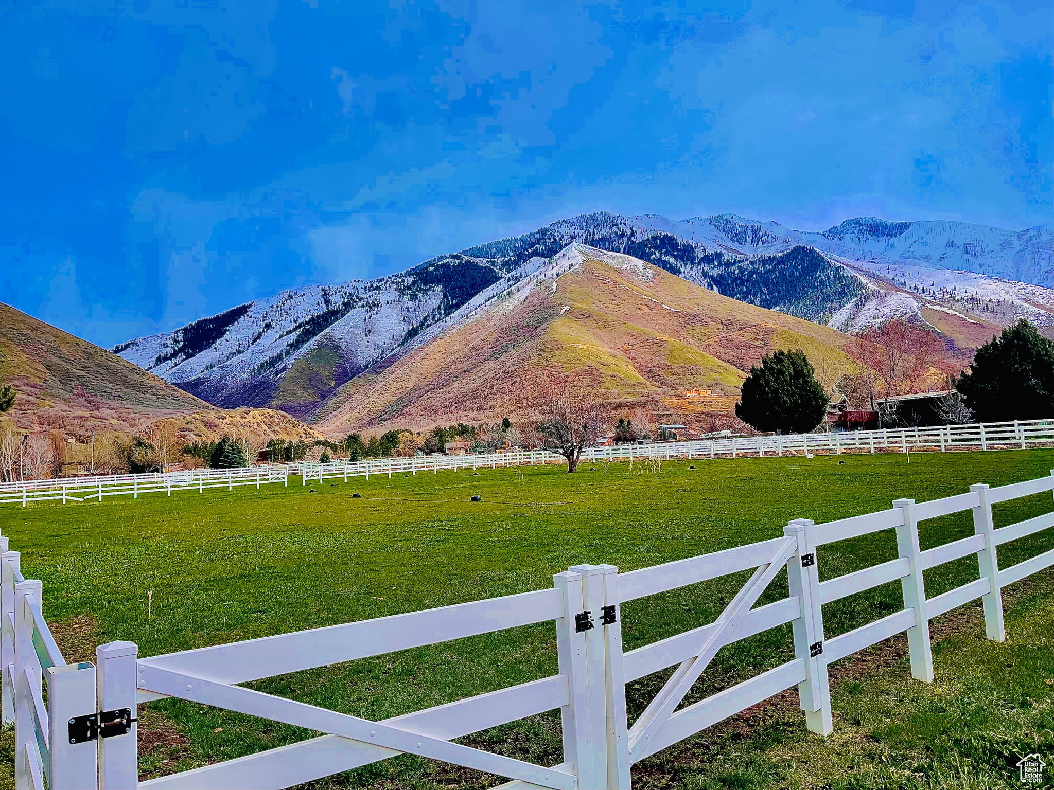 Property view of mountains with a rural view