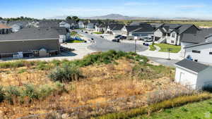 Birds eye view of property with a mountain view