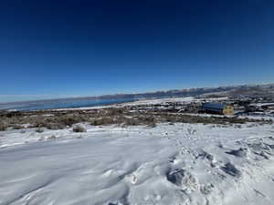 View of yard covered in snow