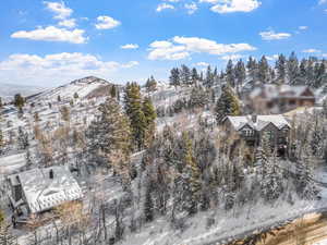 Snowy aerial view with a mountain view