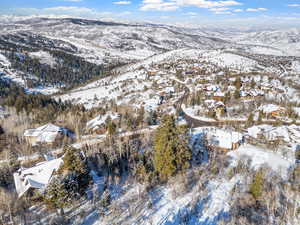 Snowy aerial view featuring a mountain view