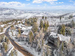 Snowy aerial view with a mountain view