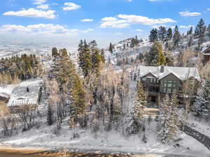 Snowy aerial view featuring a mountain view