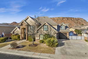 View of front of house featuring a garage and a mountain view