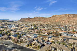 Birds eye view of property with a mountain view