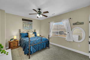 Bedroom featuring carpet flooring and ceiling fan