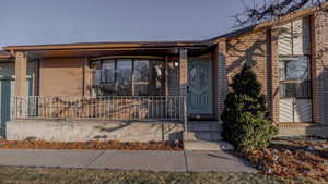 View of front of house with covered porch