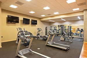 Exercise room featuring a drop ceiling