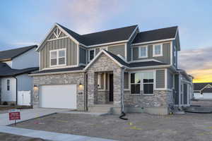 View of front of property featuring a garage