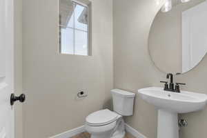 Bathroom with sink and toilet