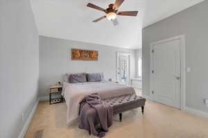 Bedroom featuring light colored carpet and ceiling fan