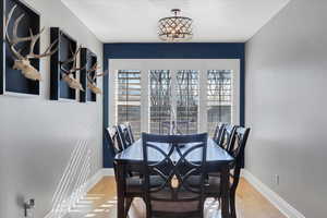 Dining space featuring wood-type flooring