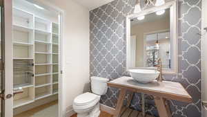 Bathroom with tile patterned flooring, sink, and toilet