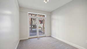 Unfurnished room featuring carpet flooring