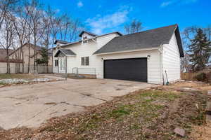 View of front of property featuring a garage