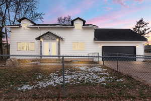 View of front of property featuring a garage