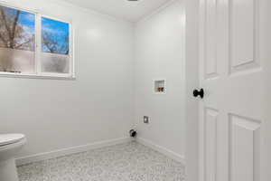 Laundry room featuring washer hookup, light tile patterned floors, ornamental molding, and hookup for an electric dryer