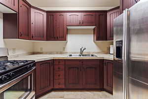 Kitchen with appliances with stainless steel finishes and sink