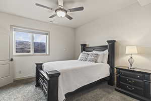 Bedroom featuring ceiling fan and carpet flooring