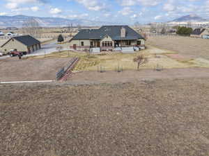 View of front of home with a porch, a mountain view, and a rural view