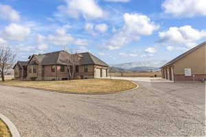 Exterior space with a mountain view and a garage