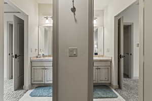 Bathroom featuring tile patterned flooring and vanity