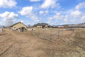 View of yard featuring a mountain view and a rural view