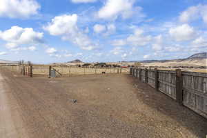 View of yard featuring a rural view and a mountain view