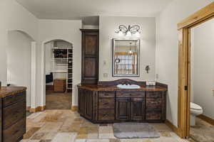 Bathroom with vanity and toilet