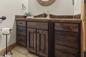 Bathroom featuring vanity and tile patterned flooring