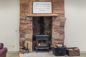 Room details with a wood stove