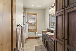 Bathroom featuring vanity and toilet