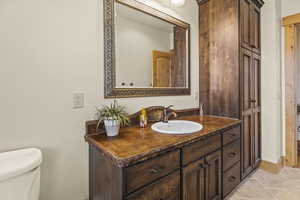 Bathroom featuring vanity and toilet