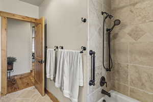 Bathroom featuring tiled shower / bath