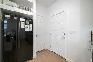 Hallway featuring light hardwood / wood-style flooring