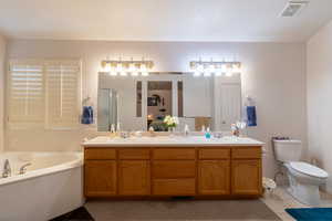 Full bathroom with tile flooring, vanity, independent shower and bath