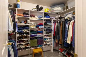 Walk in closet with carpet