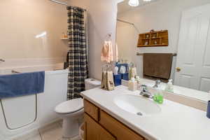 Bathroom featuring vanity and tile floors