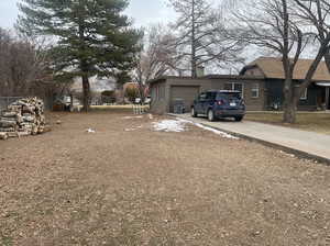 View of yard with a garage